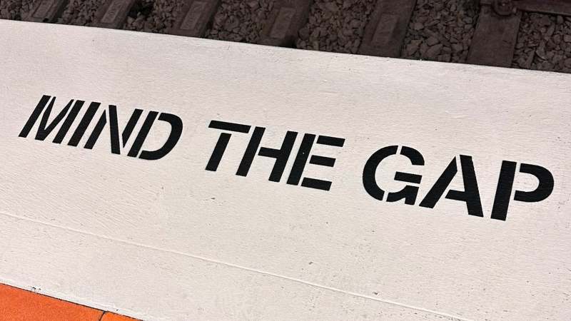 image taken at the train station showing 'mind the gap' messaging
